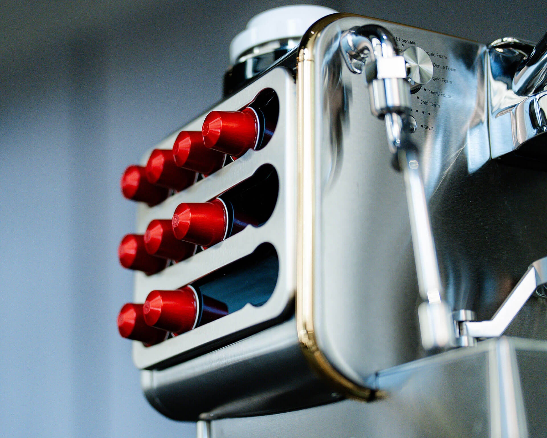 Cuisine Barista Capsule Holder in silver mounted on a machine and loaded with red capsules